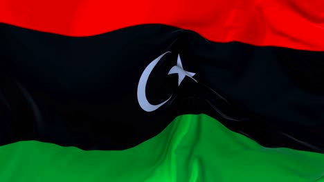 libya flag waving in wind slow motion animation . 4k realistic fabric texture flag smooth blowing on a windy day continuous seamless loop background.