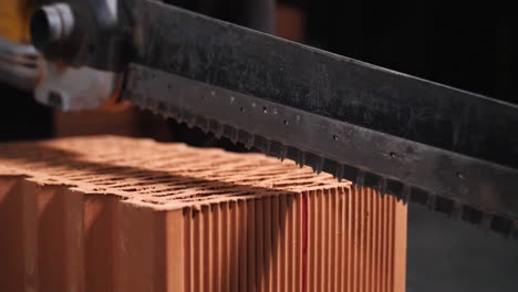 cutting a brick with a reciprocating saw