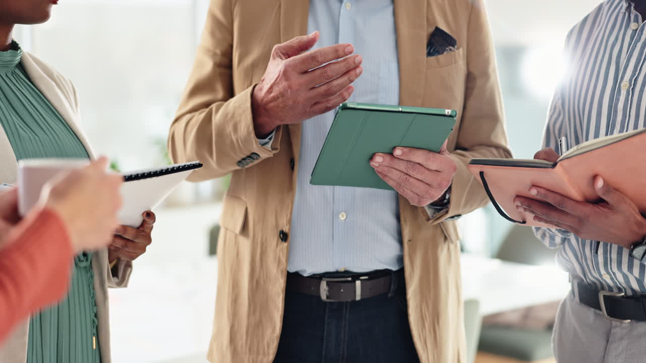 Business meeting with tablet and notebook