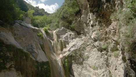 circling drone shot of dimosari waterfall  in lefkada