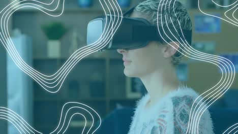 Animation-of-network-of-connections-over-woman-wearing-vr-headset