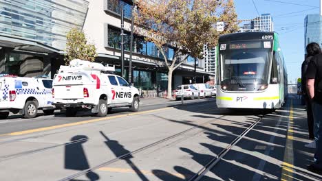 tram moves towards police presence on city street