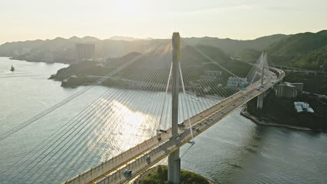 cars crossing ting kau bridge in tsing yi, hong kong, aerial view in sunrise