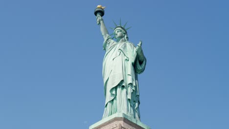 slow motion landscape of statue of liberty monument landmark holding torch iconic new york city tourism sightseeing usa america travel battery park manhattan
