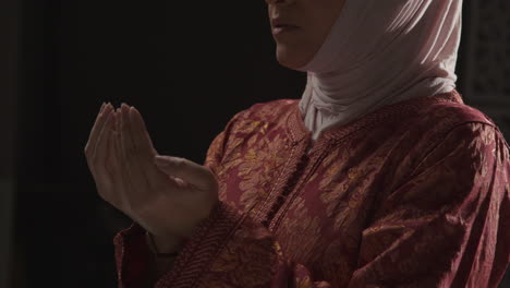 Studio-Head-And-Shoulders-Portrait-Of-Muslim-Woman-Wearing-Hijab-Praying-5