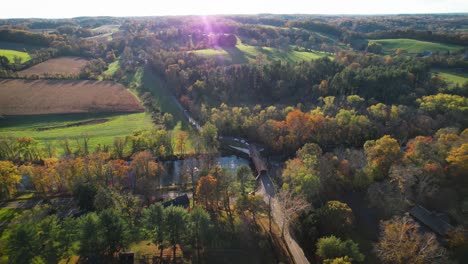 autumn river valley drone sideways sunny afternoon