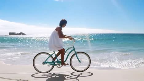 woman cycling on the beach