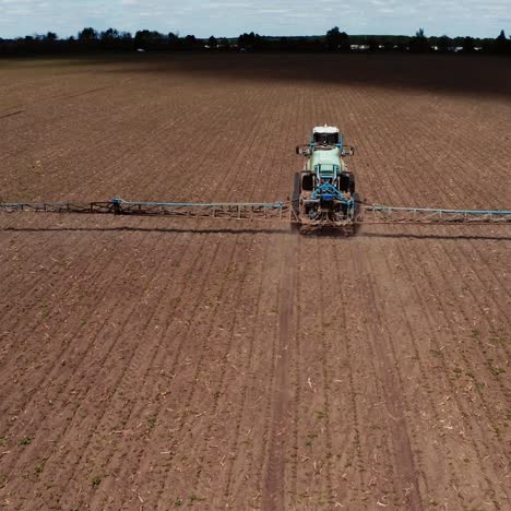 tractor vehicles working at field