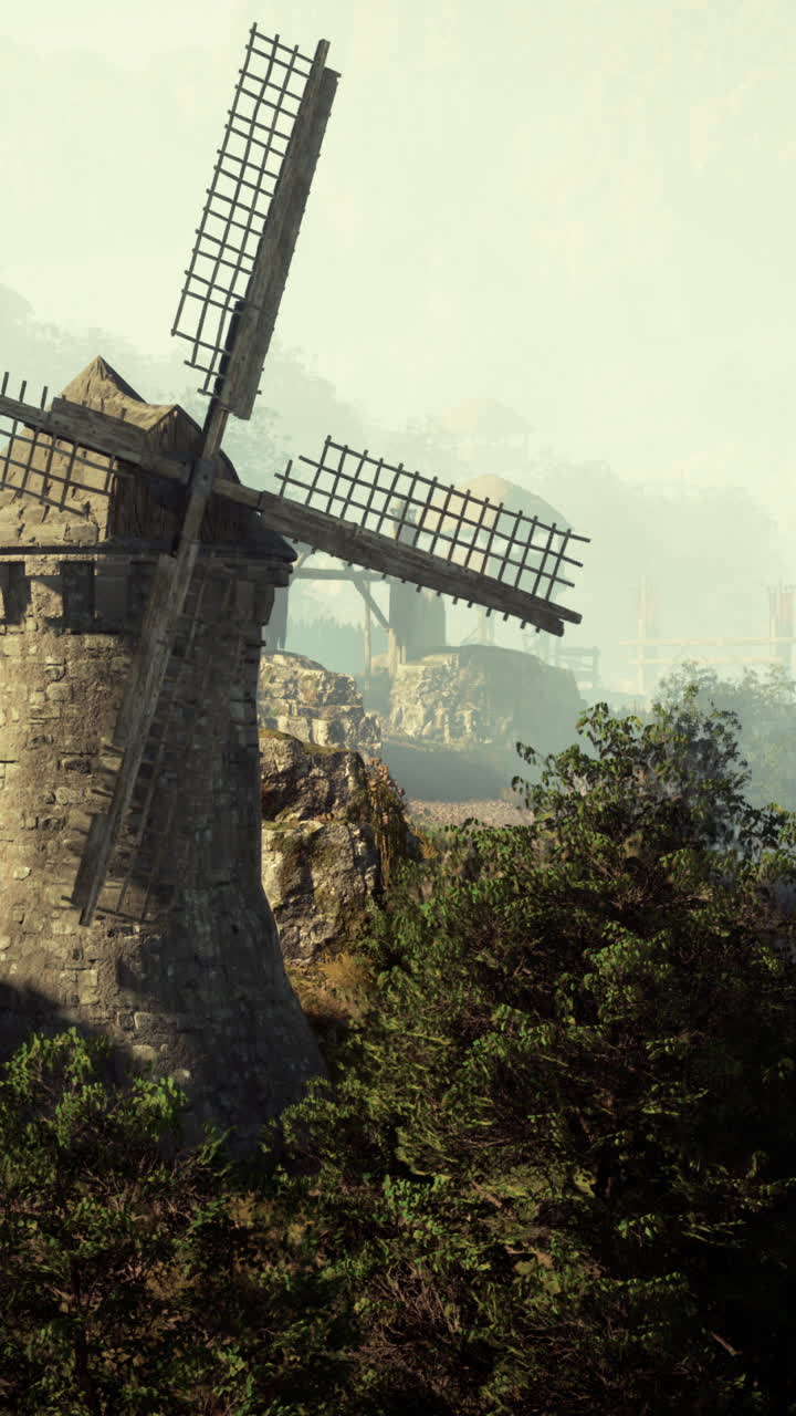 старая каменная ветряная мельница в туманном лесу