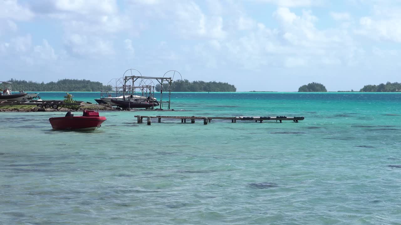Bora Bora Island Lagoon, French Polynesia, Boats and Dock on Coastline, Motu Islets in Background