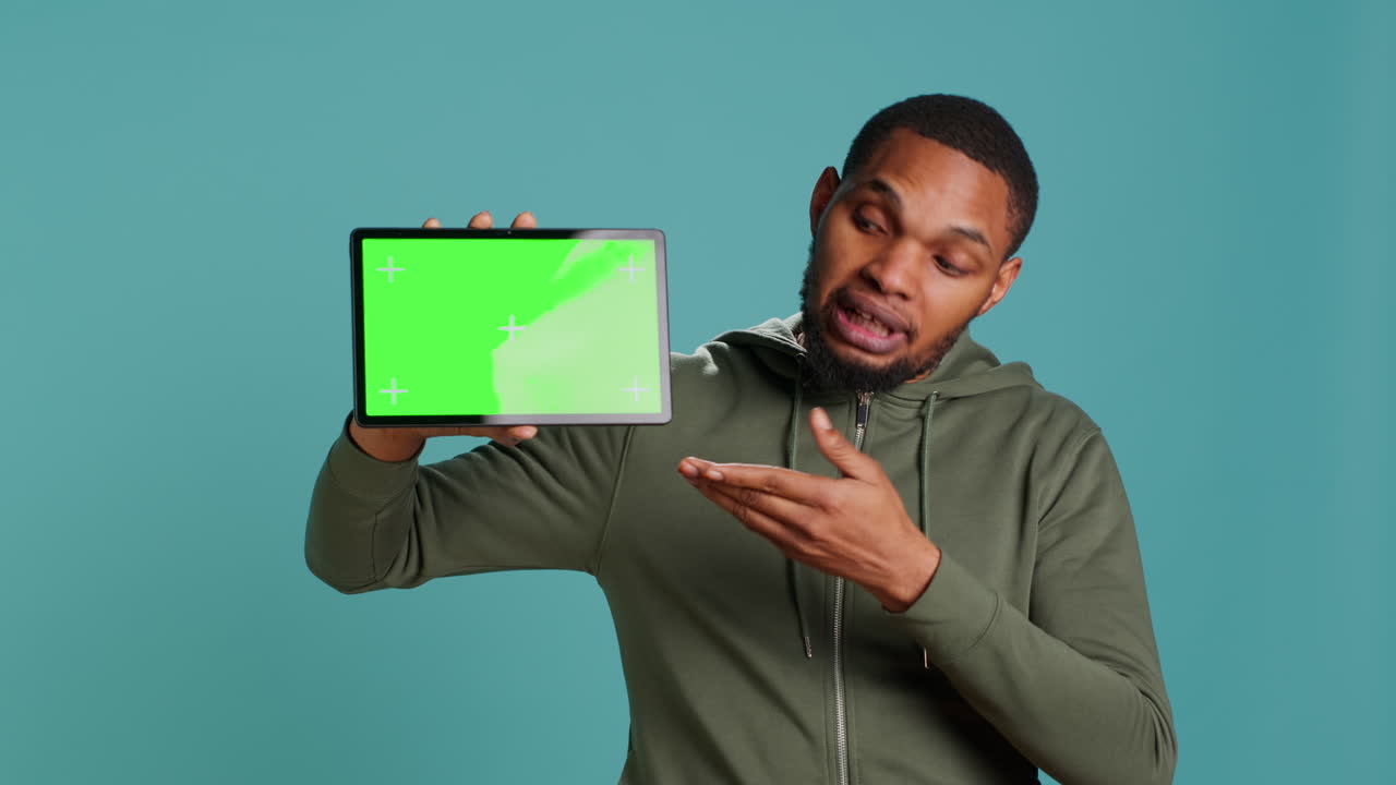Tech content creator holding isolated screen tablet, doing advertisement