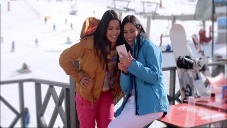 two young woman checking out a selfie