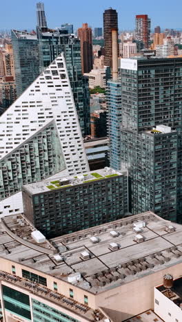 outstanding multistoried buildings of unusual design. new york scenery on bright sunny day. top view. vertical video
