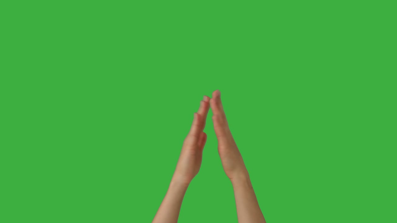 Woman clapping her hands over green screen