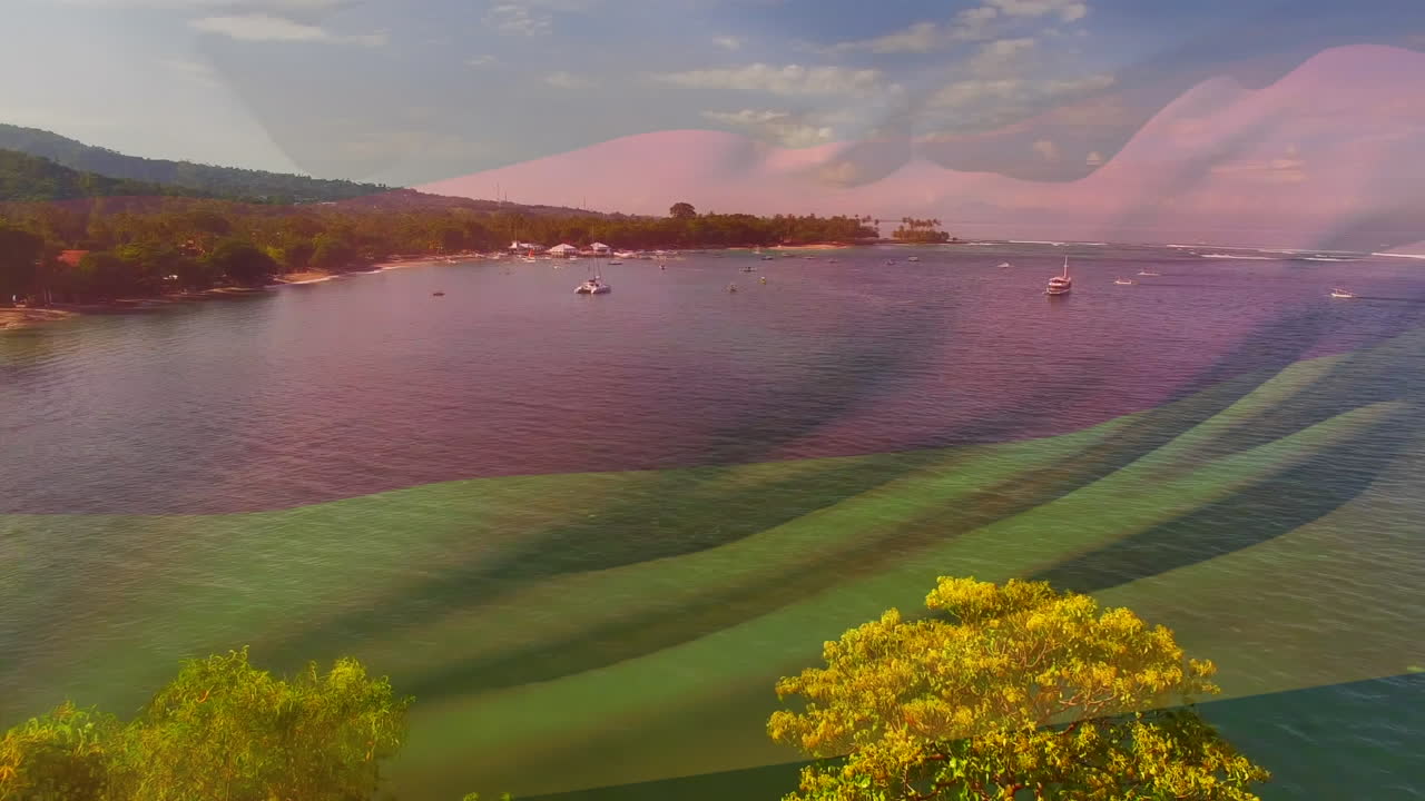 composición digital de agitar la bandera de alemania contra la vista aérea del mar
