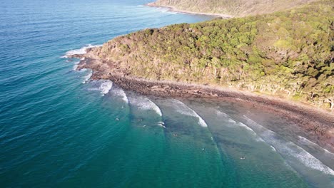 noosa heads with surfers on queensland's sunshine coast, australia - drone shot