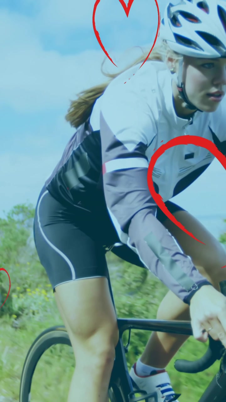 Animace padajících srdcí přes cyklistky.