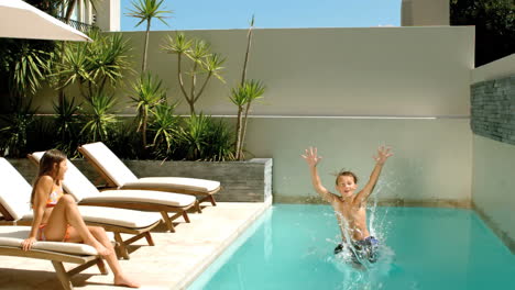 Little-boy-diving-into-the-swimming-pool