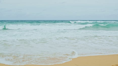 sea waves seamless loop on the white phuket sand beach