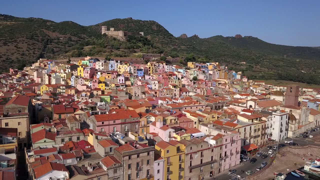 Bosa, Sardinia, Italy -Drone Aerial Shot over the colourful town of Bosa and its castle. A typical Italian and mediterranean landscape