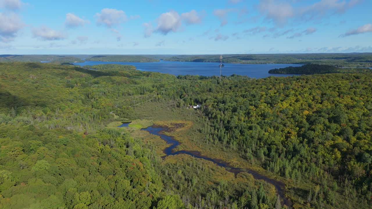 Lake Vernon and Muskoka forest surround Huntsville in Ontario, Canada Aerial