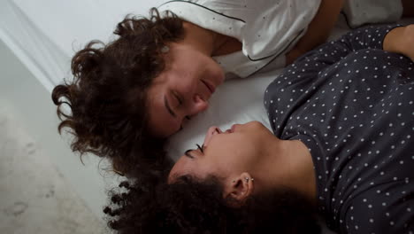 Lovely-couple-laying-on-bed