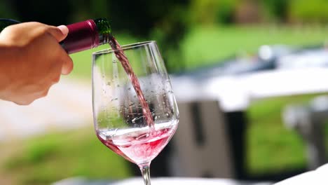 Waiter-pouring-wine-in-a-glass