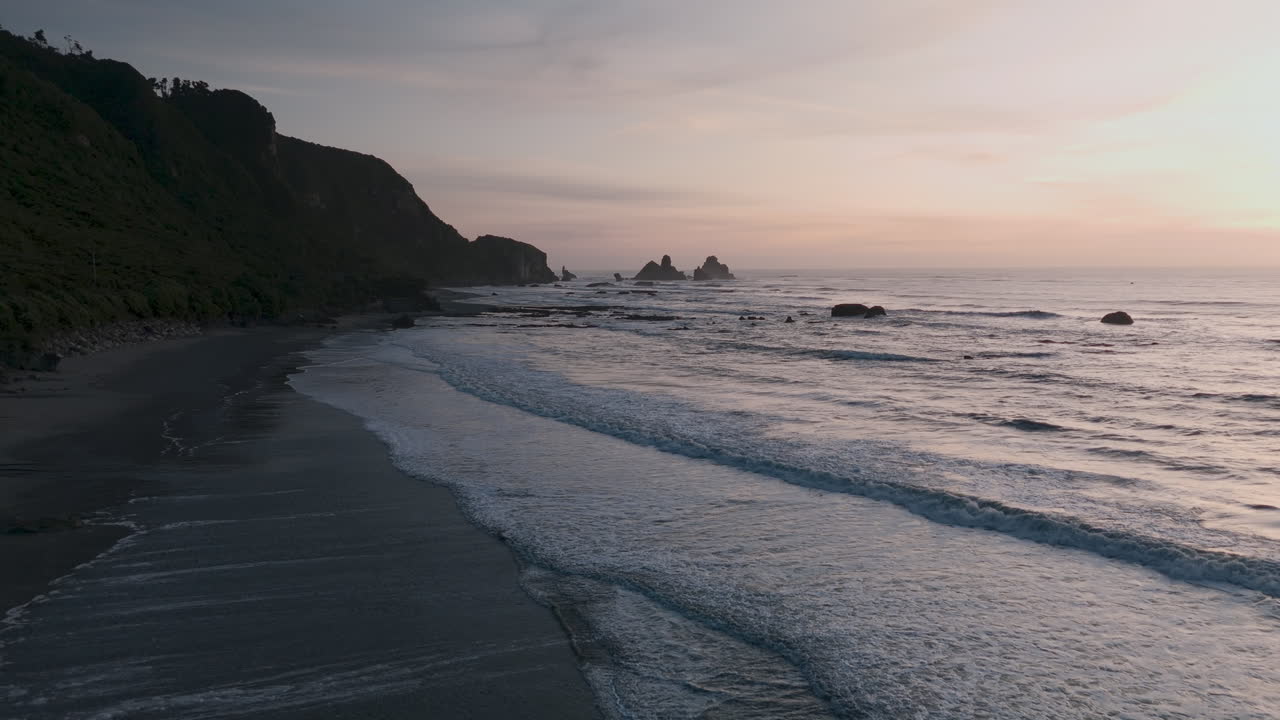 Sunset over a Rocky Coastline Beach
