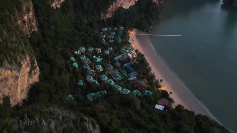 beautiful touristic resort spa cenvaree between green trees and high rocks at a nice sandy beach at the andaman sea