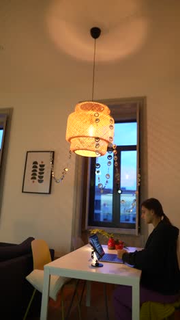 woman working from home in a cozy dining room