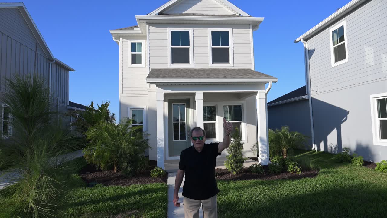 senior citizen happy for his new construction South Florida home