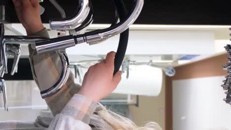 woman installing a faucet