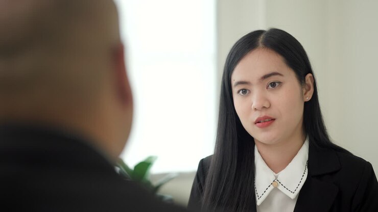 Business woman to greet a HR staff before a job interview to apply for a job. Happy woman seeker or insurance broker presenting a business deal. Smart asian woman sending resume.