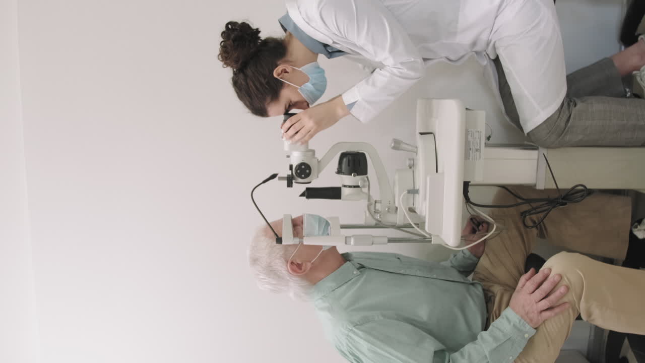 Senior Man Having His Eyesight Checked At Oculist