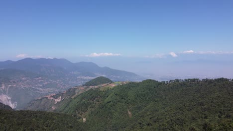 A-beautiful-aerial-view-of-the-Himalaya-Foothills-of-Nepal-with-the-Mountains-in-the-background