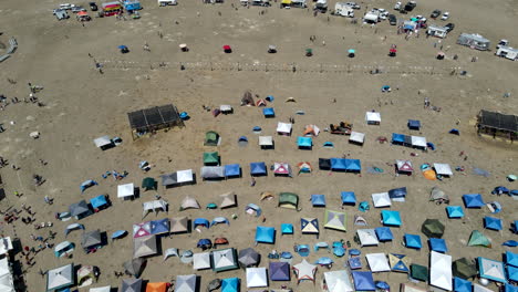 cinematic drone flyover of patrons being entertained at a music festival in white sulphur springs, mt.