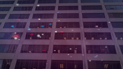 animation of red blue and white spots over building