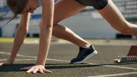 slow motion: girl athlete waits for start of race in 400 meters. girl athlete waits for start of race in 100 meters during. running at the stadium from the pads on the treadmill