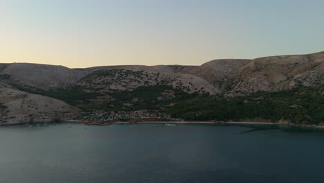 stara baska, krk island, croatia, aerial view of the mountains and coast with boats, beaches and adriatic sea. the seaside rv campmobiles on a summer beautiful coastline at sunset summer evening