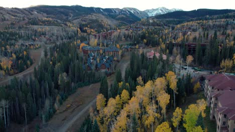 drone shot scaling up the side of the mountain in mountain village, colorado