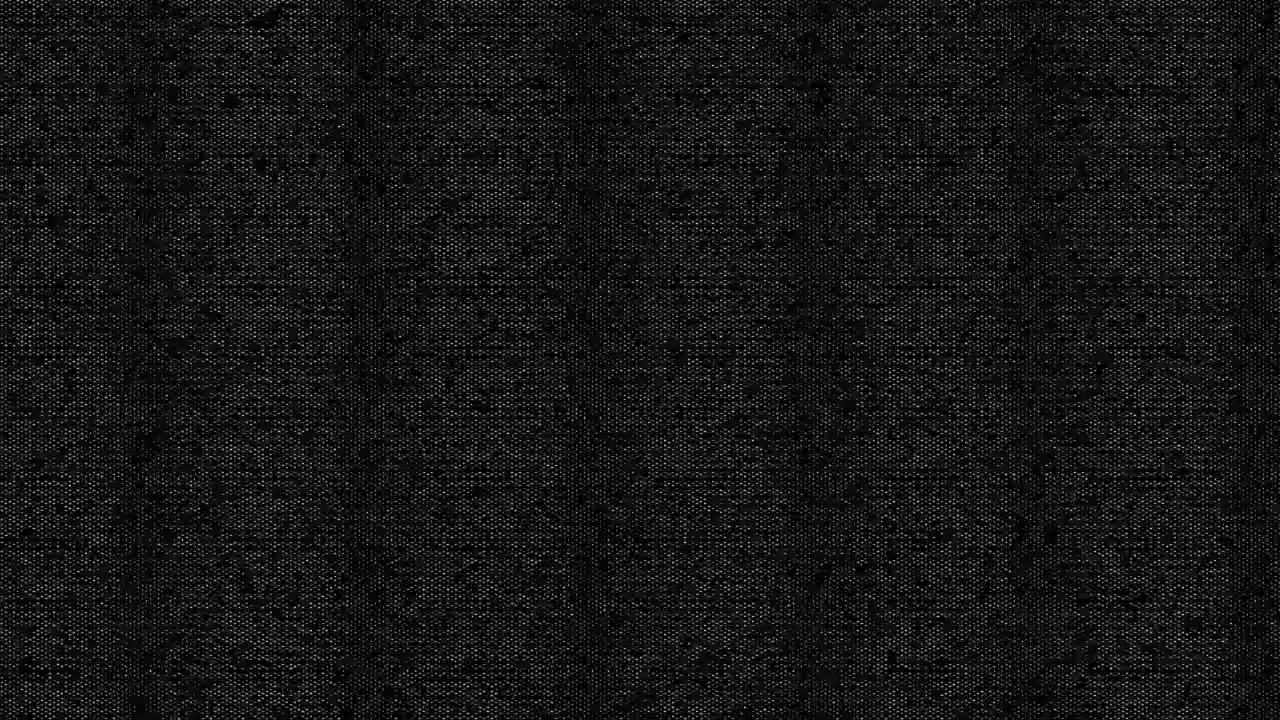 Detail textury tmavě černé látky.