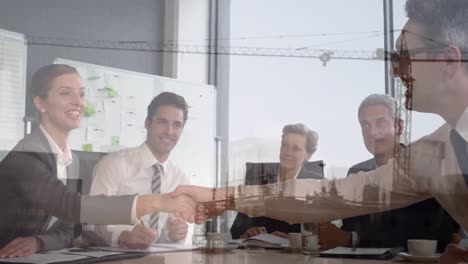 Animation-of-building-site-over-business-people-talking-in-office