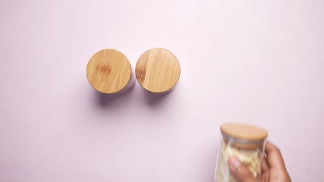 top view of two round containers with wooden lids