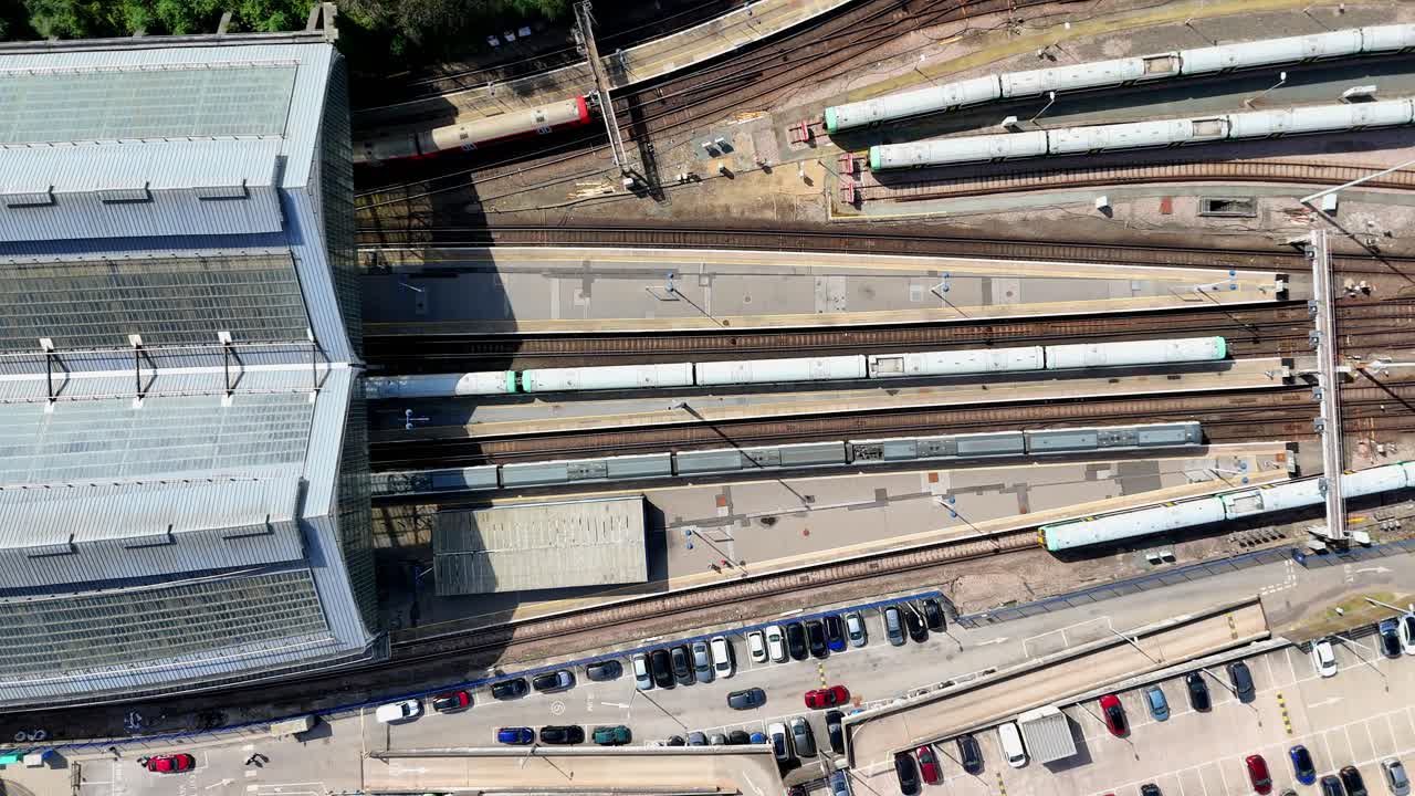 Vibrant aerial footage captures Brighton’s historic train station, bustling with activity as trains arrive and depart, highlighting the city’s lively atmosphere and its popularity.