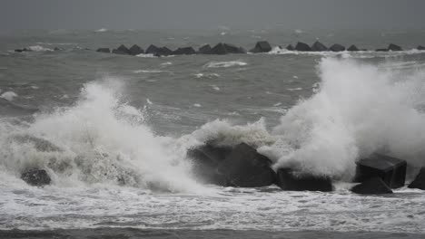 powerful waves crashing on rocks