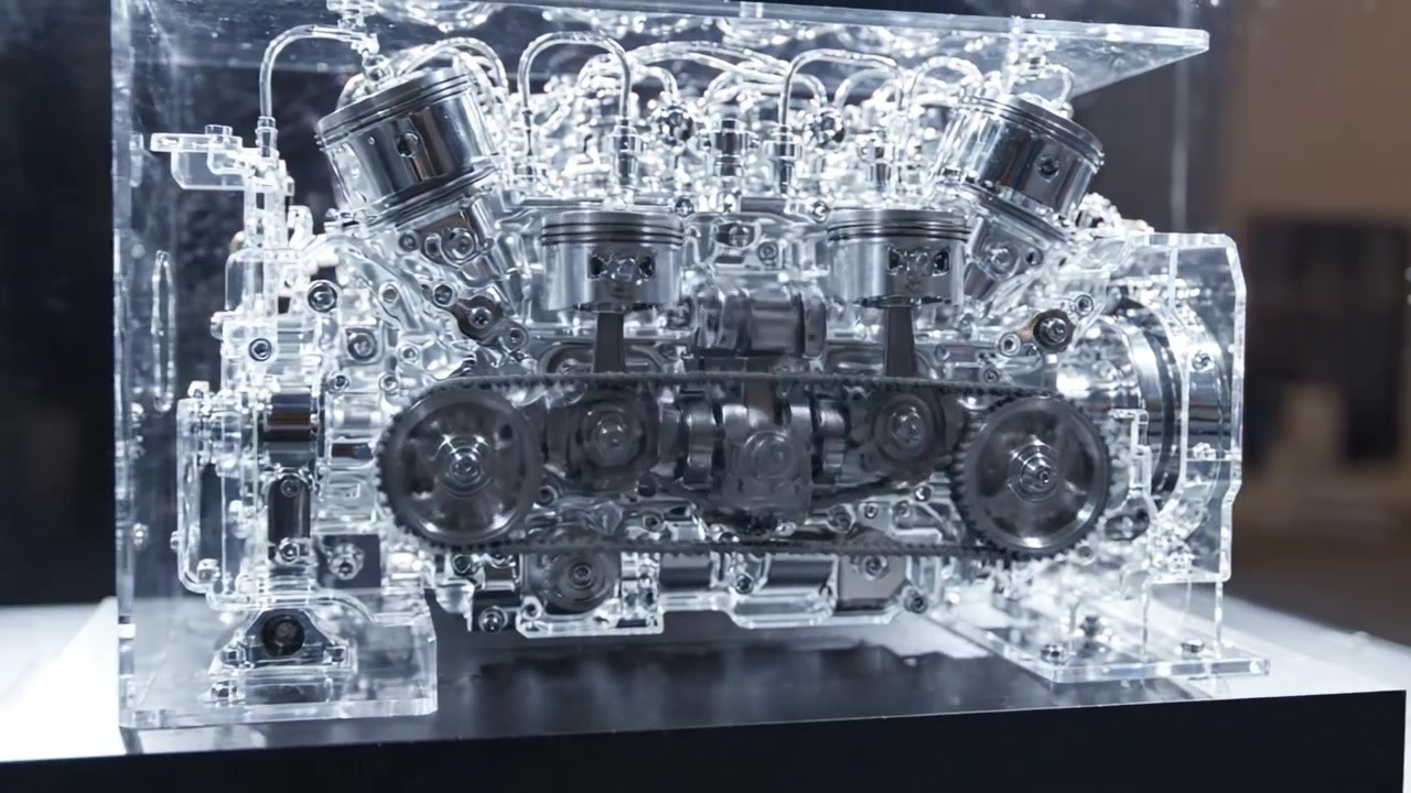 Stunning Close-up of a Transparent Engine Model Showcasing Intricate Mechanical Components and Engineering Precision in an Artistic Display
