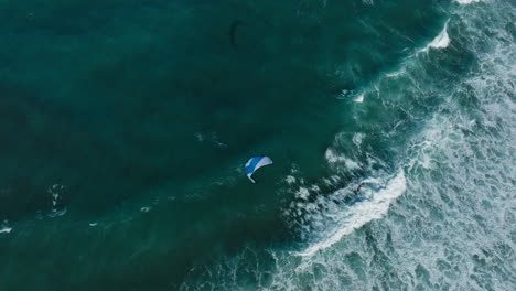 aerial view of kiteboarding in powerful waves