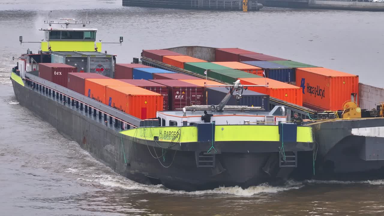 Large Cargo Barge Transporting Shipping Containers on a River