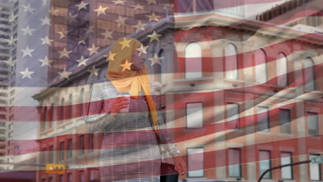 animation of american flag waving over biracial woman in hijab holding takeaway coffee cup