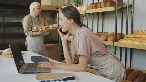 people working in small business bakery